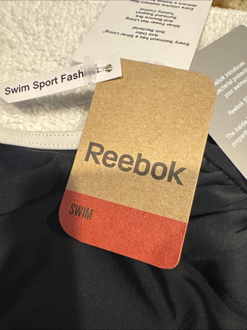 Reebok Black and White One-Piece Swimsuit with Front Zip. New and never worn.